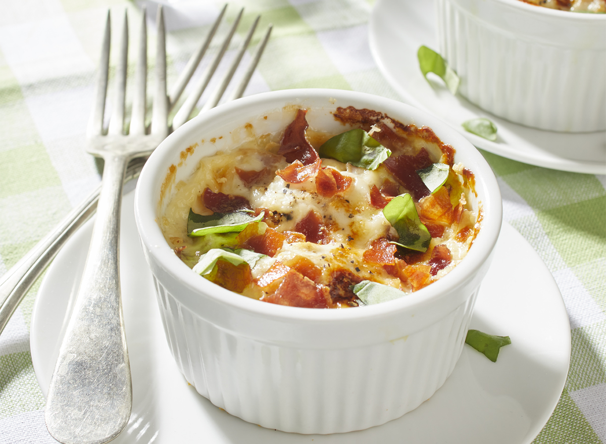 baked eggs in cream with prosciutto parmesan basil